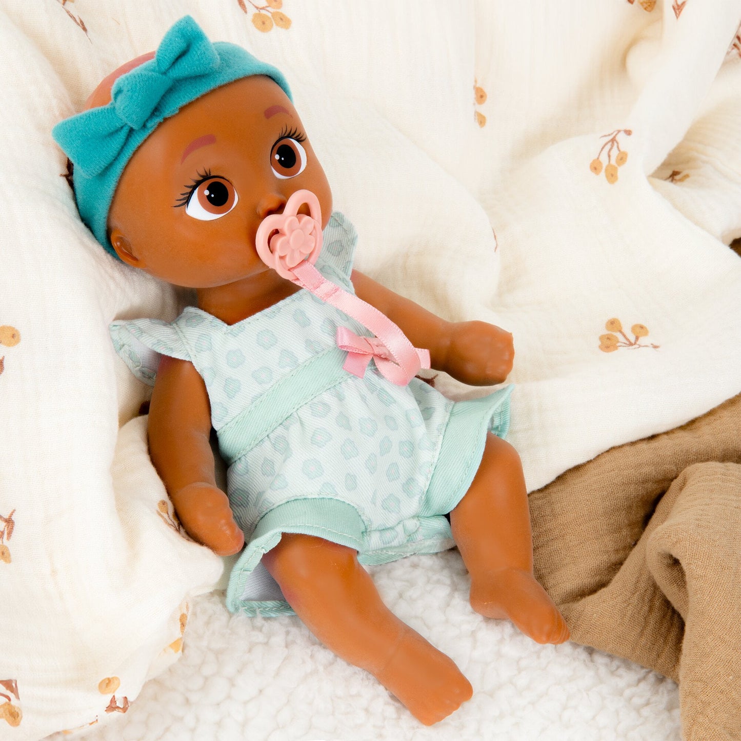 Mini Logan Realistic Doll, Soft Skin, Blue Outfit, 9-Inch Tall, 18M+